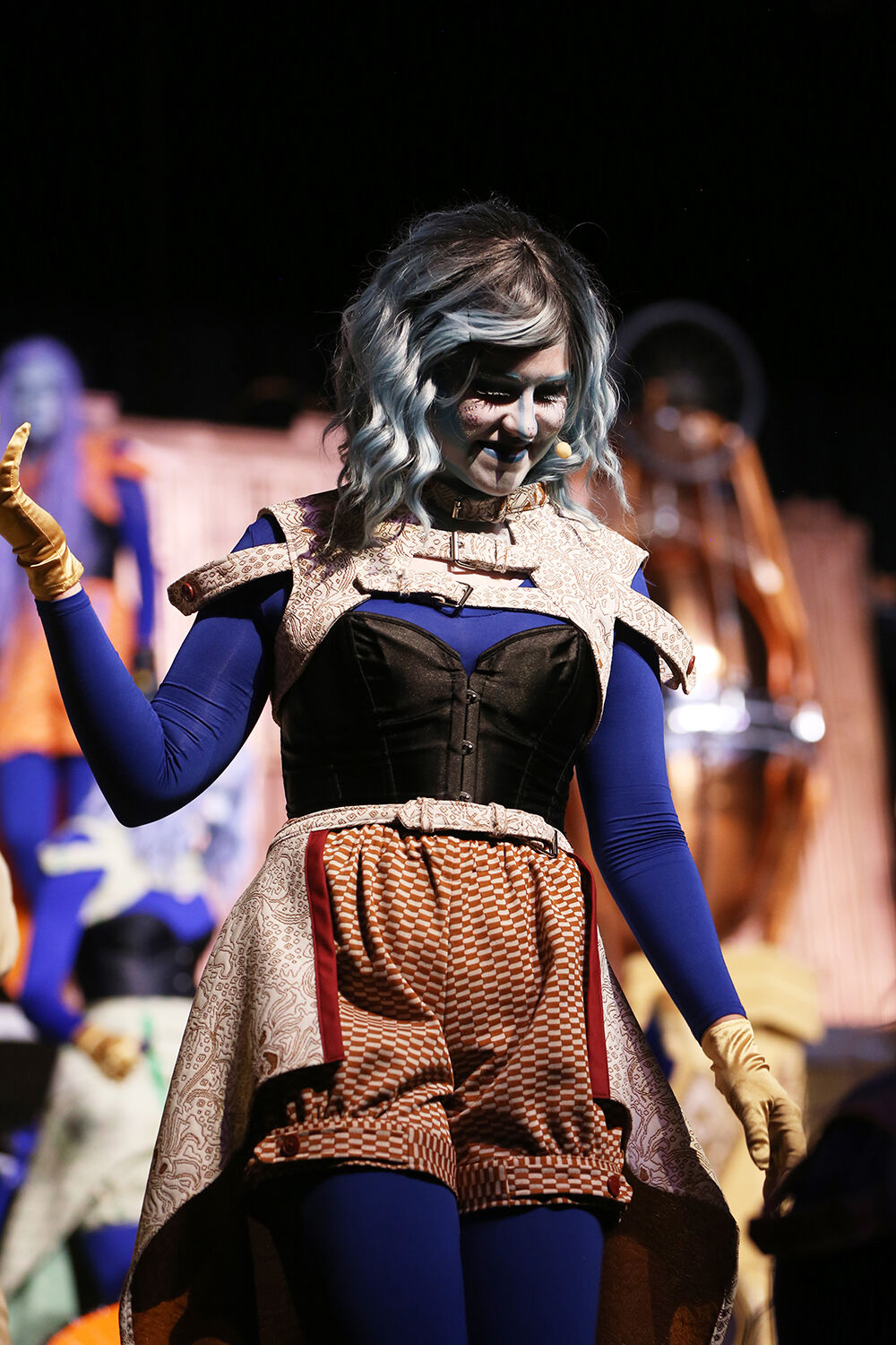 Fashionista alien Lycra, played by Evelynne Conklin, struts across the stage